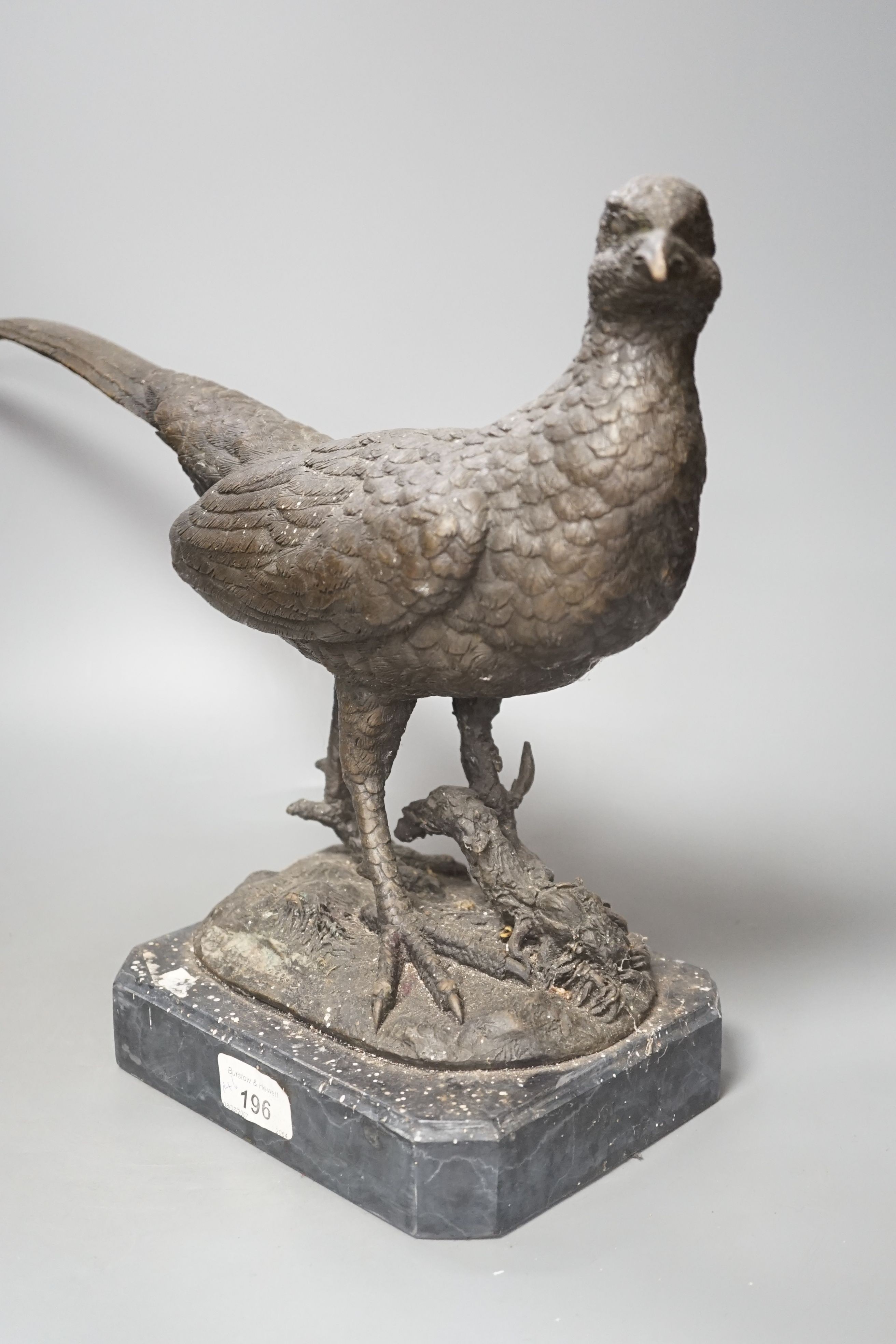 A bronzed metal pheasant, indistinctly signed, on marble base. Length 51cm